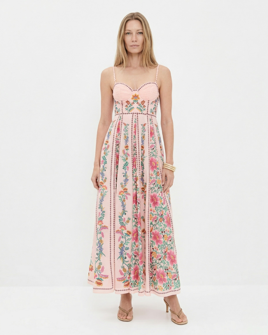 Woman wearing a floral dress on a white background