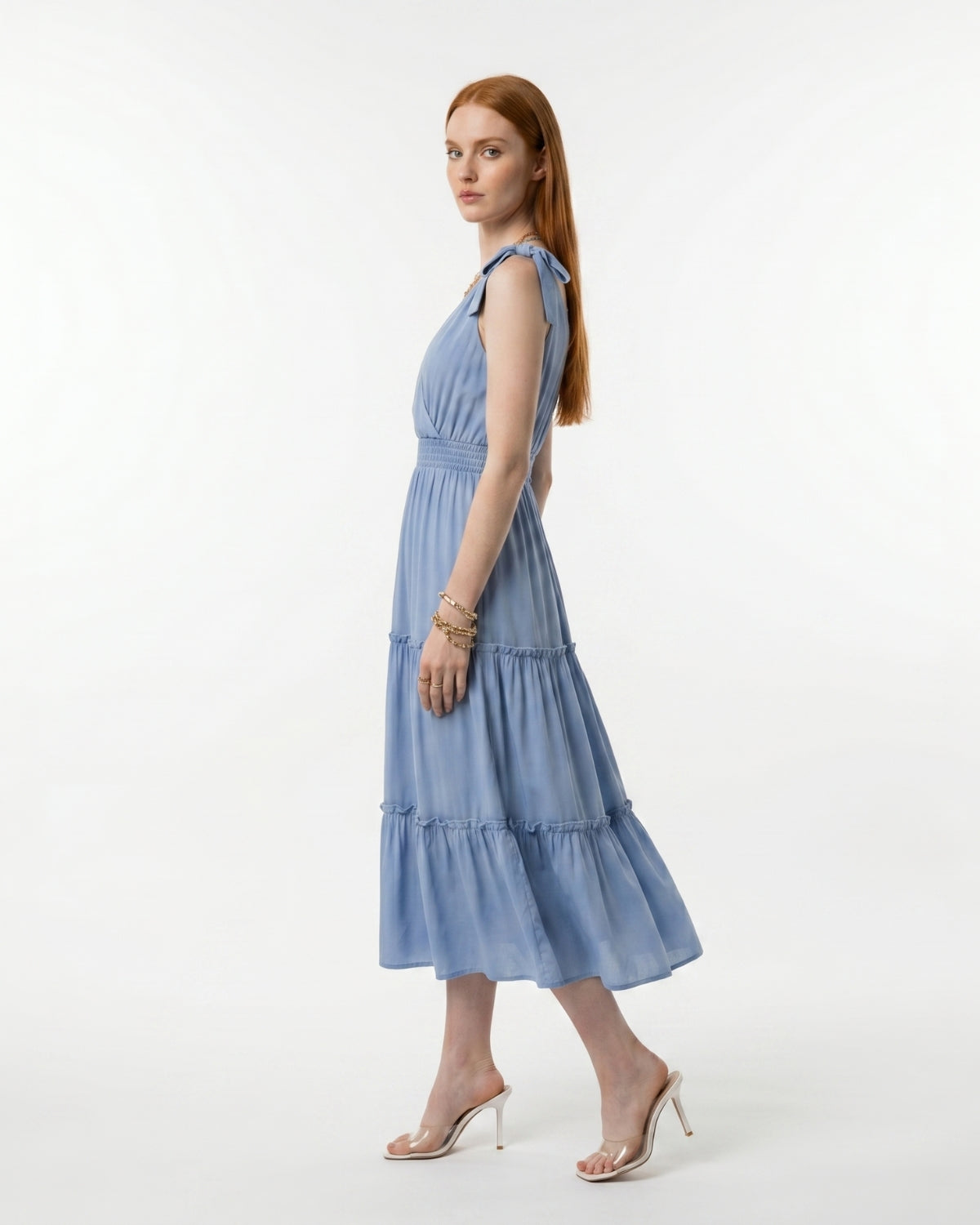 Woman wearing a blue dress on a white background