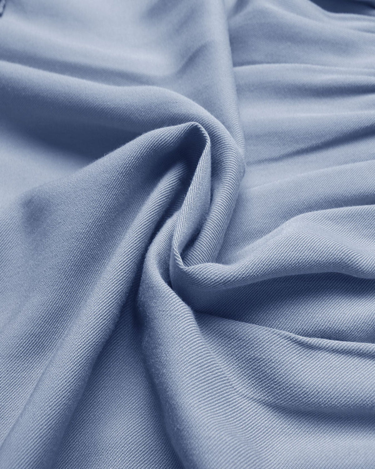 Close-up of blue fabric with folds