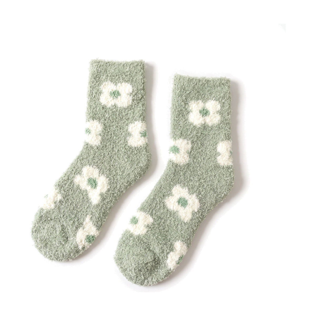 Sage green fluffy socks with white daisy pattern laid flat