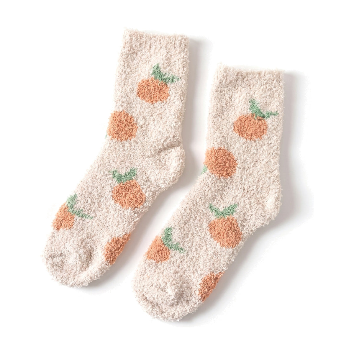 Oatmeal fluffy socks with orange fruit pattern laid flat