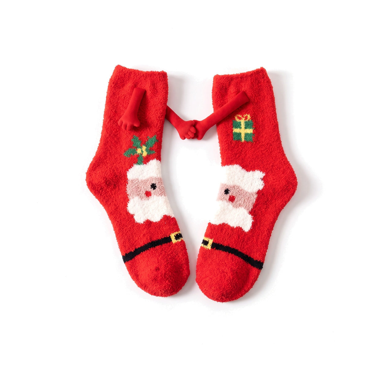 Red Santa fluffy hand holding socks laid flat with magnetic hands touching