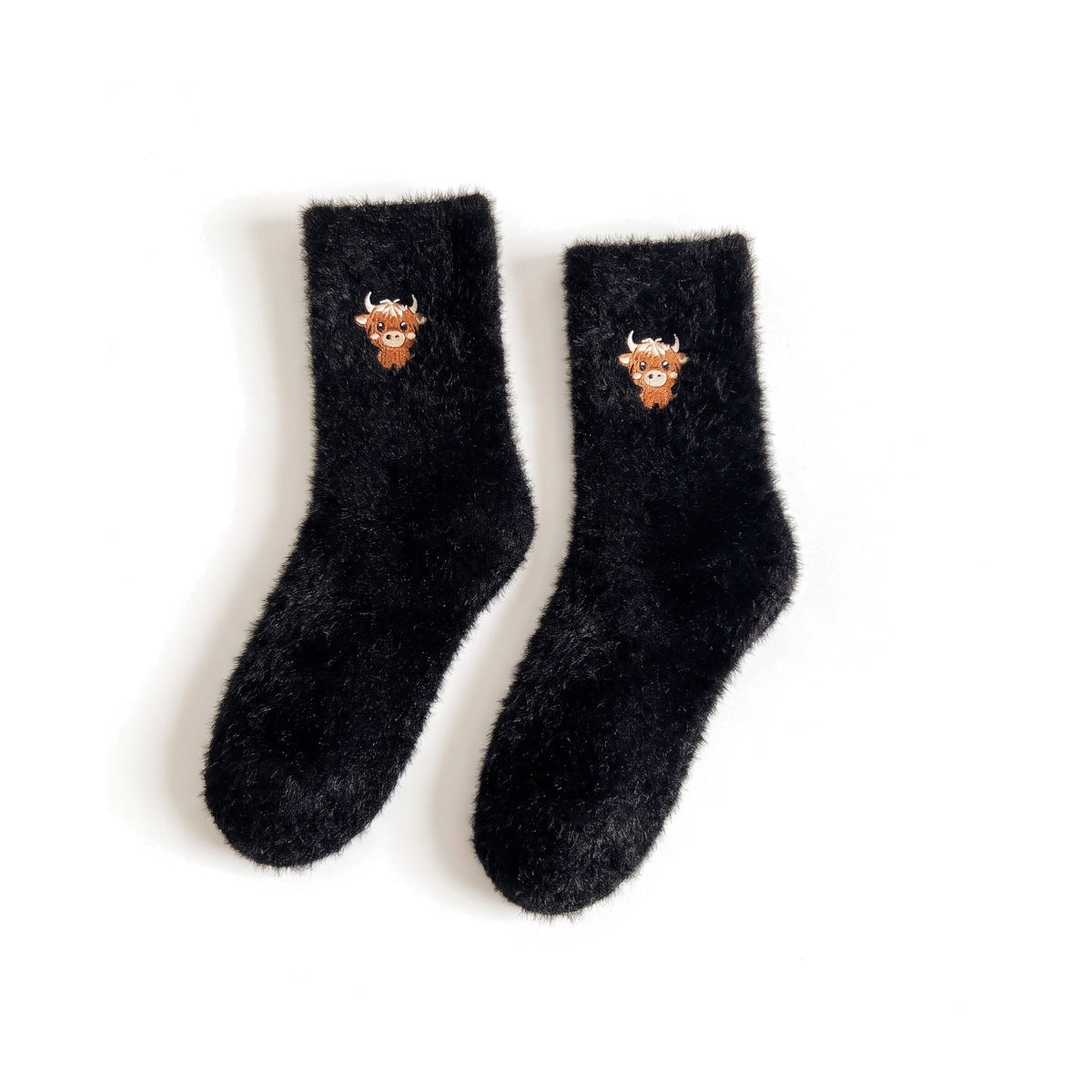 Black fluffy bed socks with embroidered Highland cow face