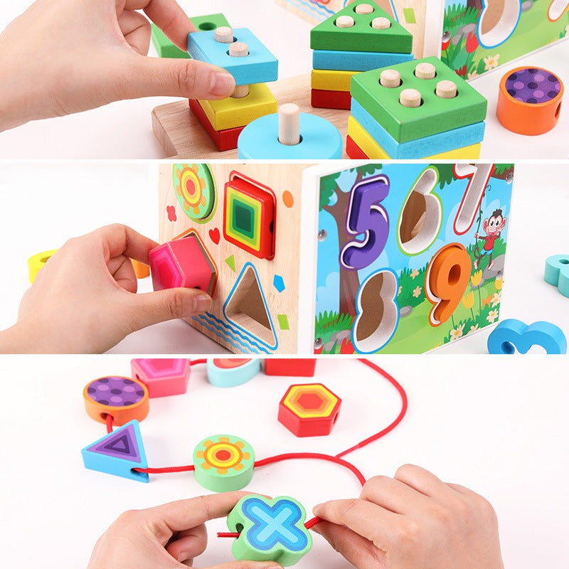 Child stacking shapes, posting blocks and threading pieces on the wooden activity cube