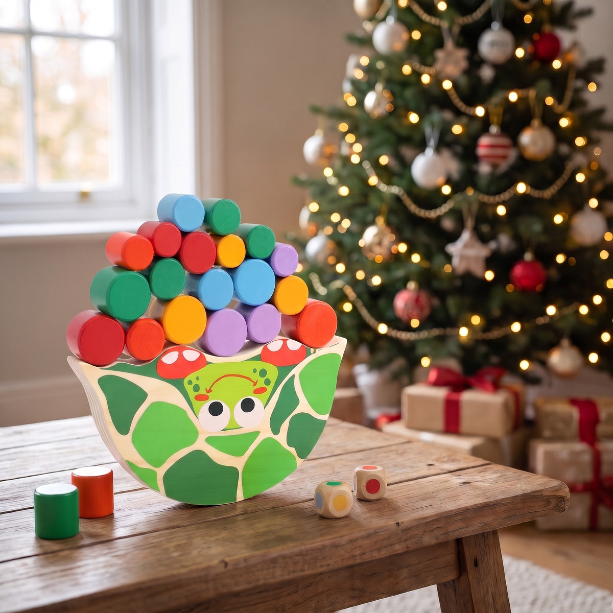 Wooden tortoise balance game on a coffee table by a Christmas tree