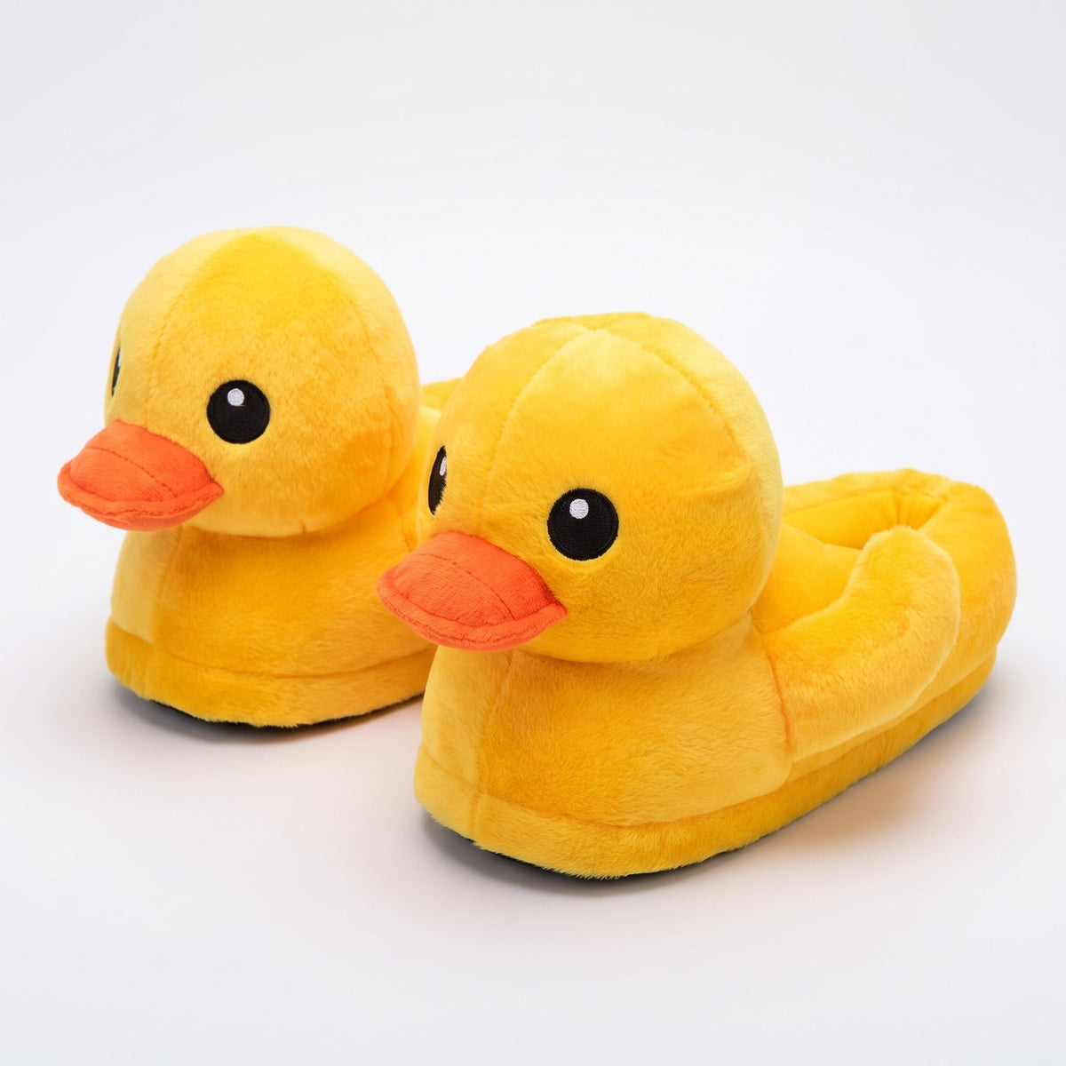 Bright yellow plush rubber duck slippers with orange beak