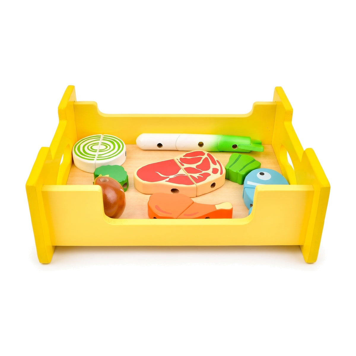 Yellow wooden grill turned over as a storage tray full of play food