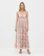Woman wearing a floral dress on a white background