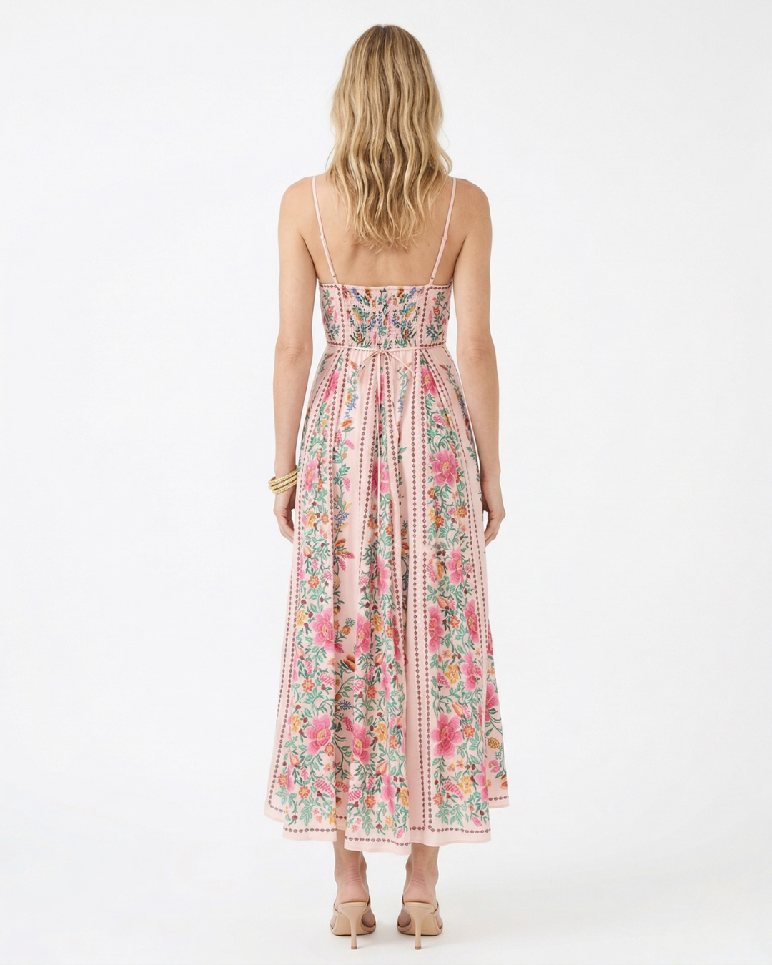 Woman wearing a floral dress on a white background