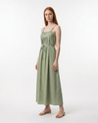 Woman wearing a green dress on a white background