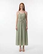 Woman wearing a green dress on a white background