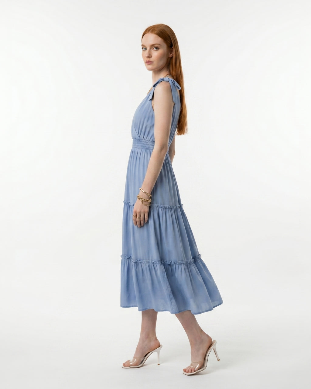 Woman wearing a blue dress on a white background