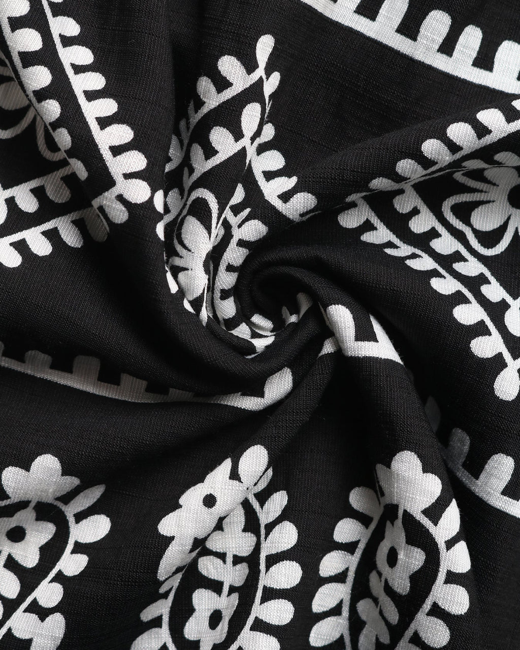 Black fabric with white floral patterns