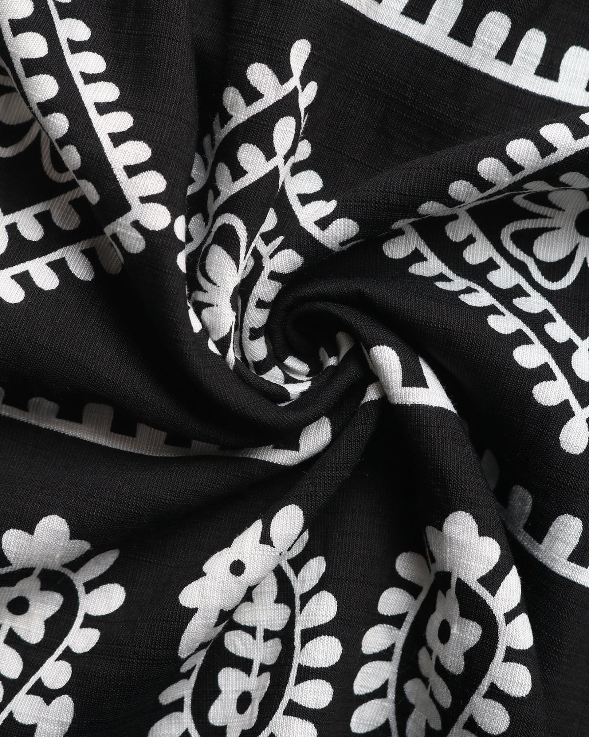Black fabric with white floral patterns