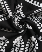 Black fabric with white floral patterns