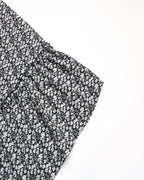 Black and white floral patterned fabric on a white background