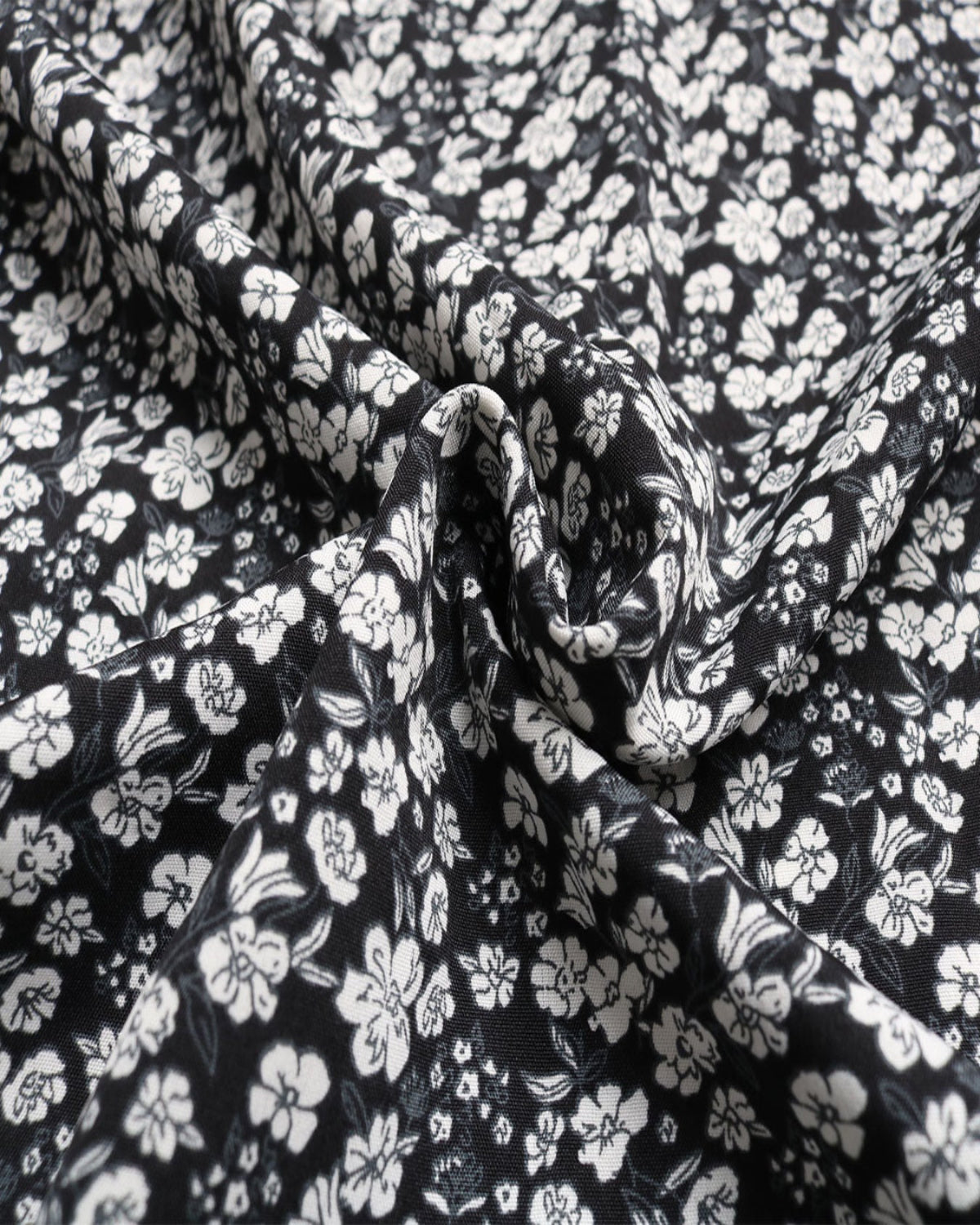 Black fabric with white floral pattern