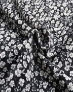 Black fabric with white floral pattern