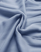 Close-up of blue fabric with folds
