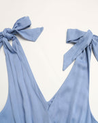 Light blue Maxi summer Dress with tied straps on a white background