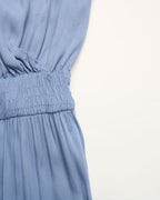 Close-up of a blue dress with a white background