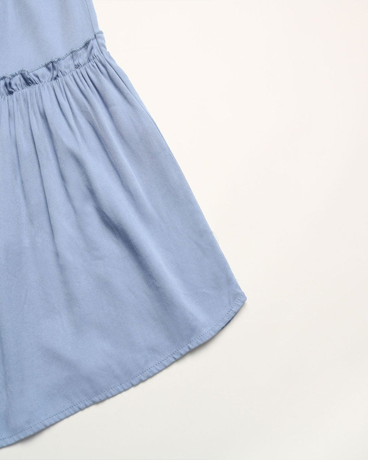 Light blue dress skirt on a light gray background