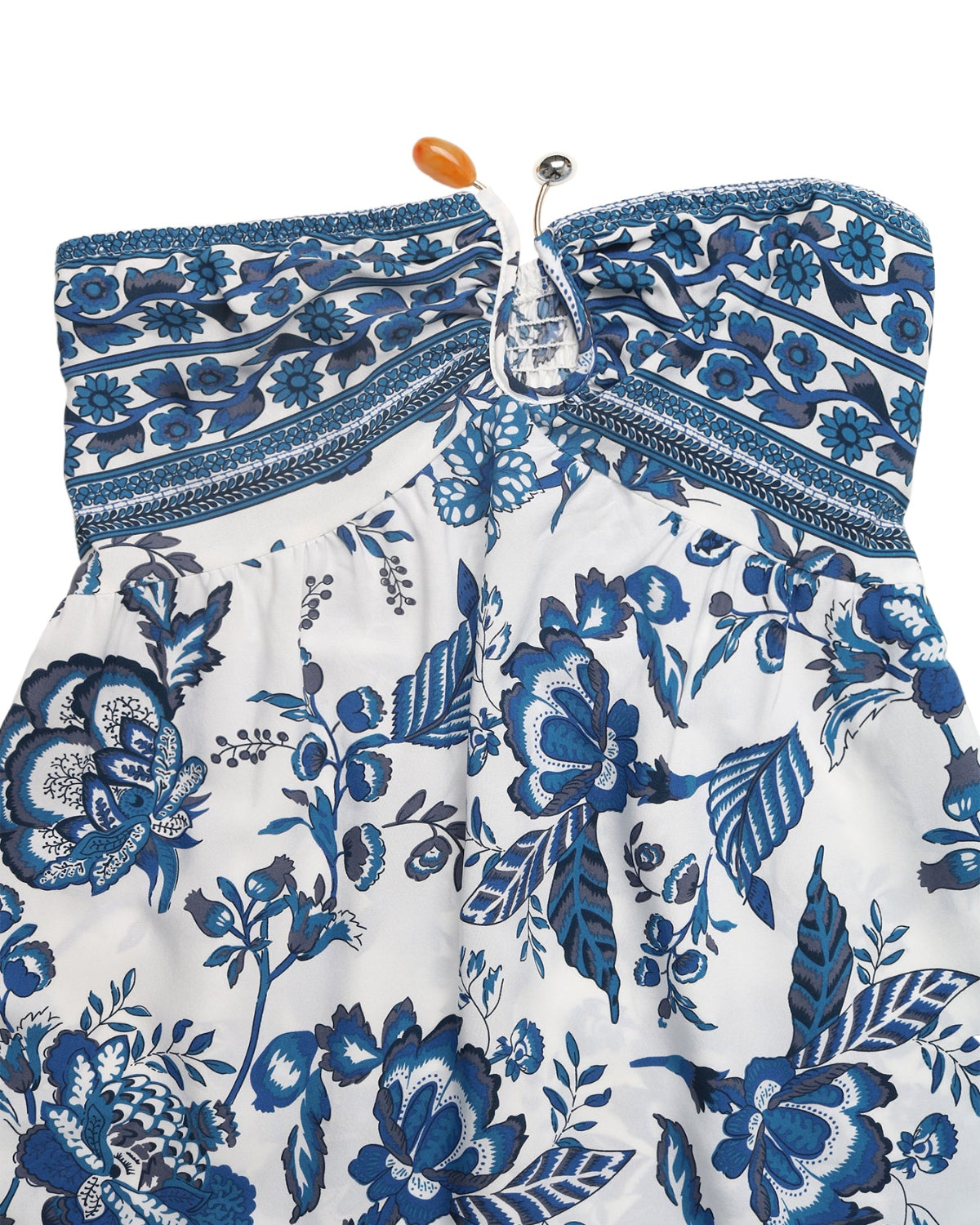 White strapless top with blue floral pattern on a white background