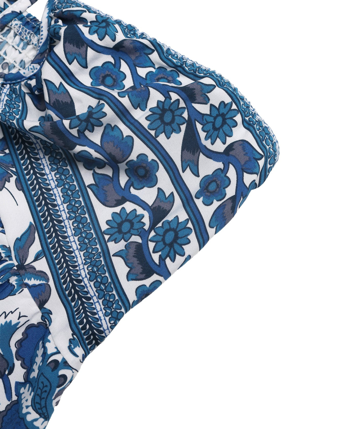 Blue and white floral patterned fabric on a white background