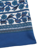 Blue and white floral patterned fabric corner