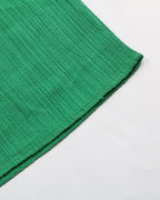Close-up of a green textured fabric on a white background