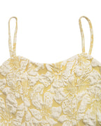 Yellow floral top with thin straps on a white background