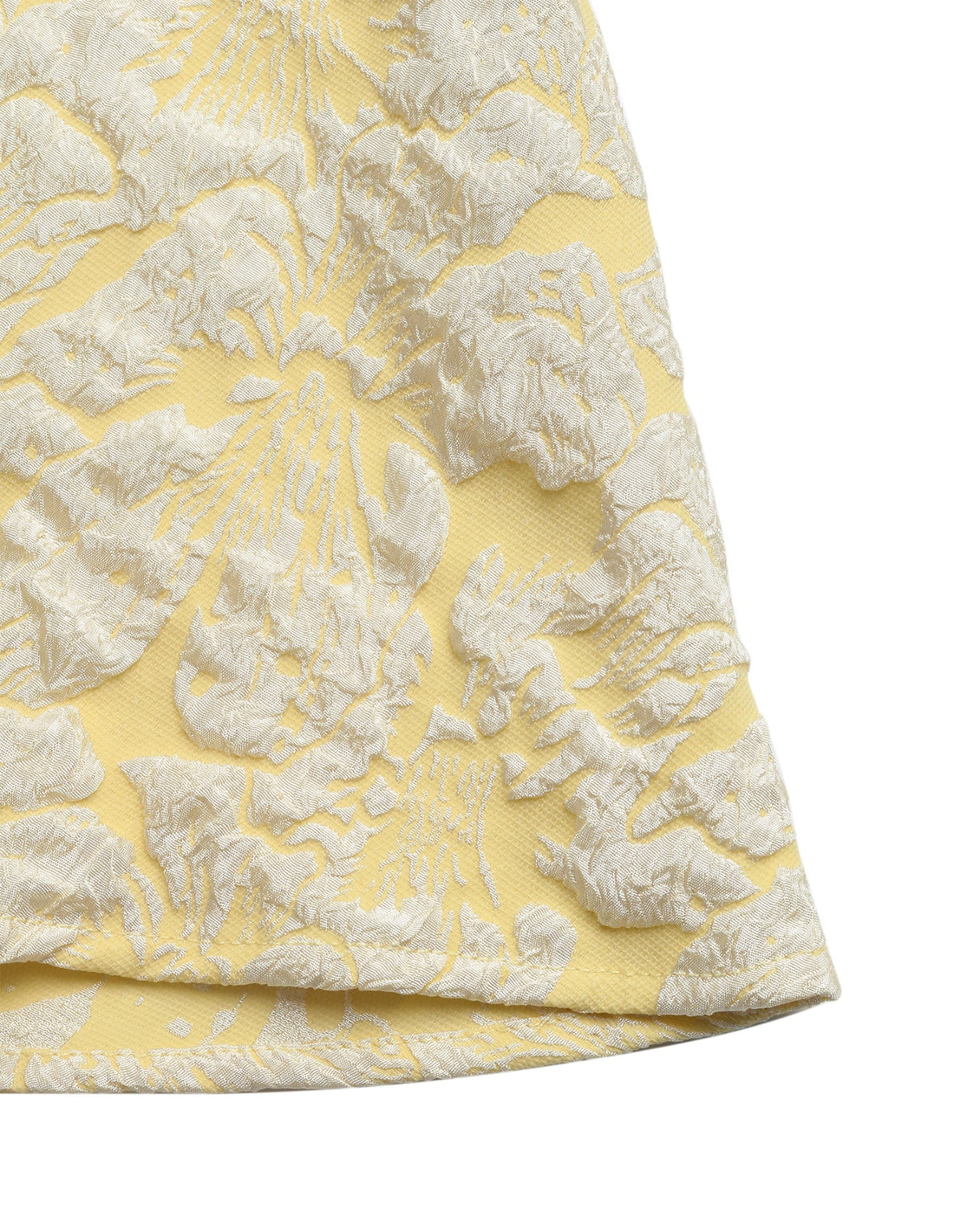 Yellow fabric with white floral pattern on a white background
