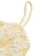 Yellow floral patterned bag with a strap on a white background