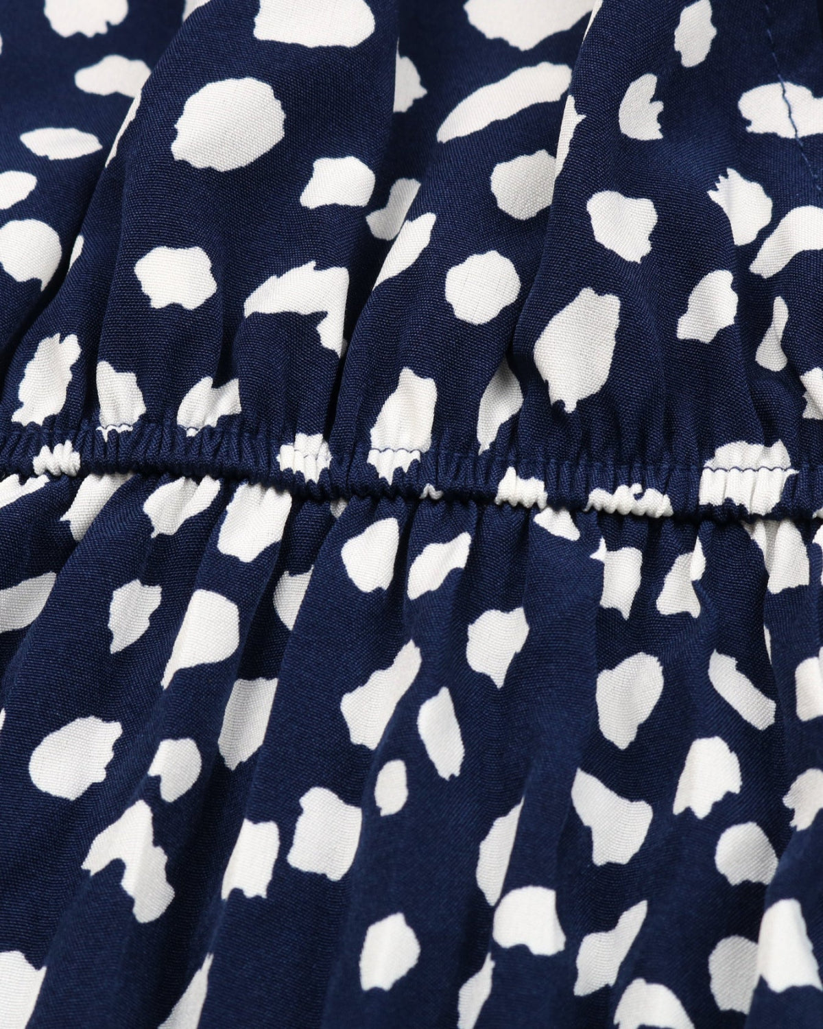 Navy blue fabric with white abstract pattern