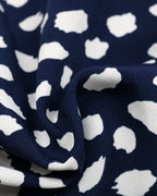 Navy blue fabric with white abstract pattern