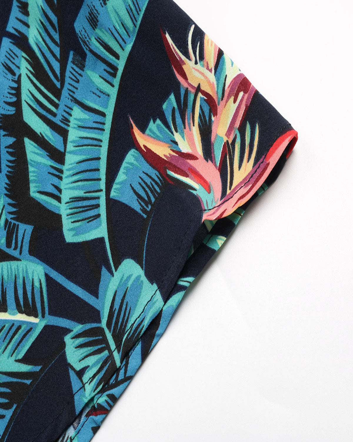 Tropical leaf patterned fabric with a white background