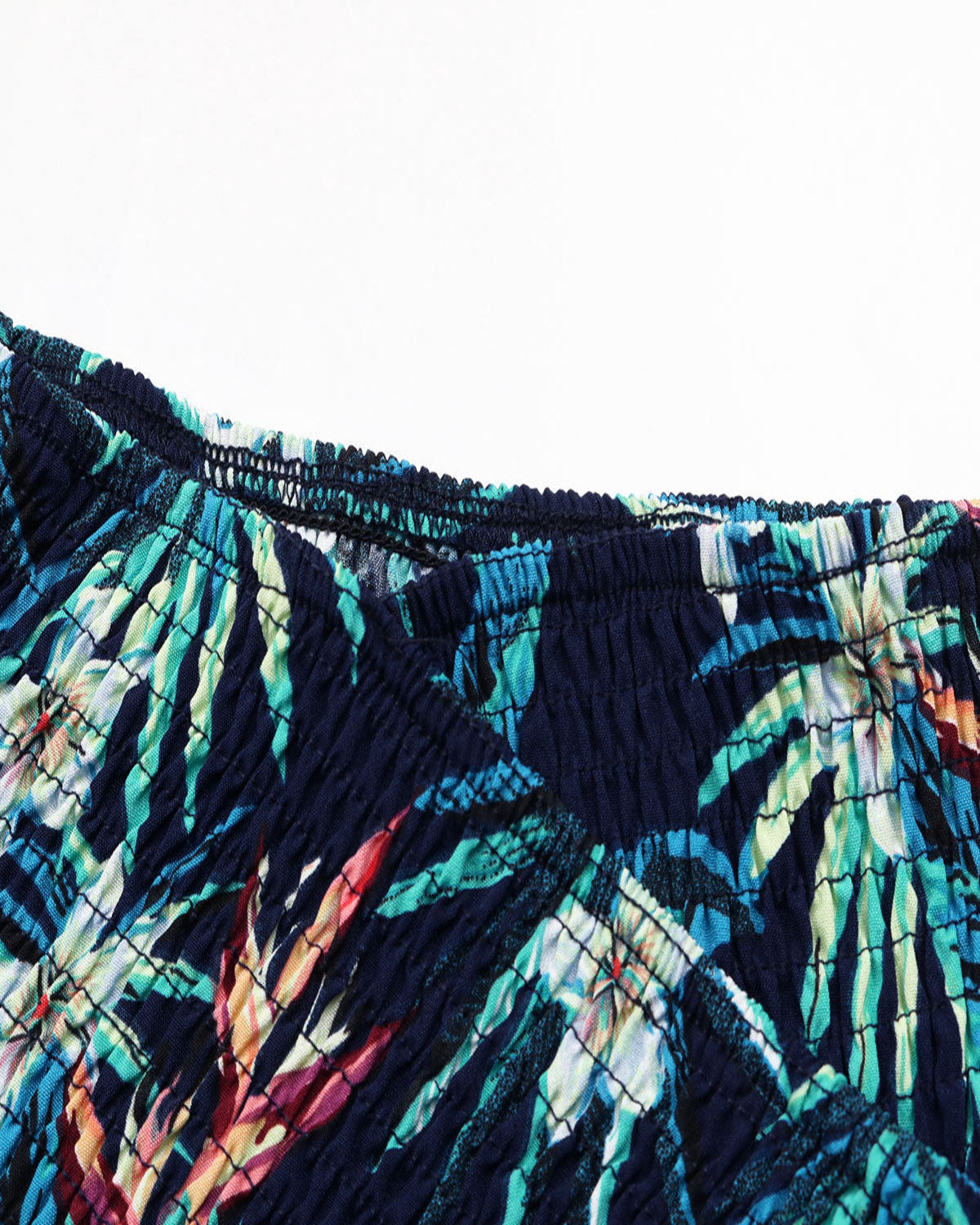 Close-up of a colorful patterned fabric with a white background