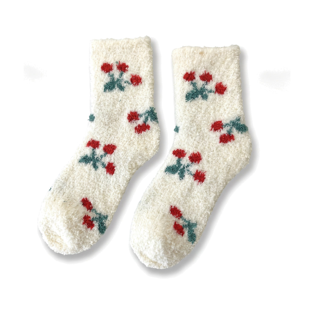 Cream fluffy socks with red cherry pattern laid flat