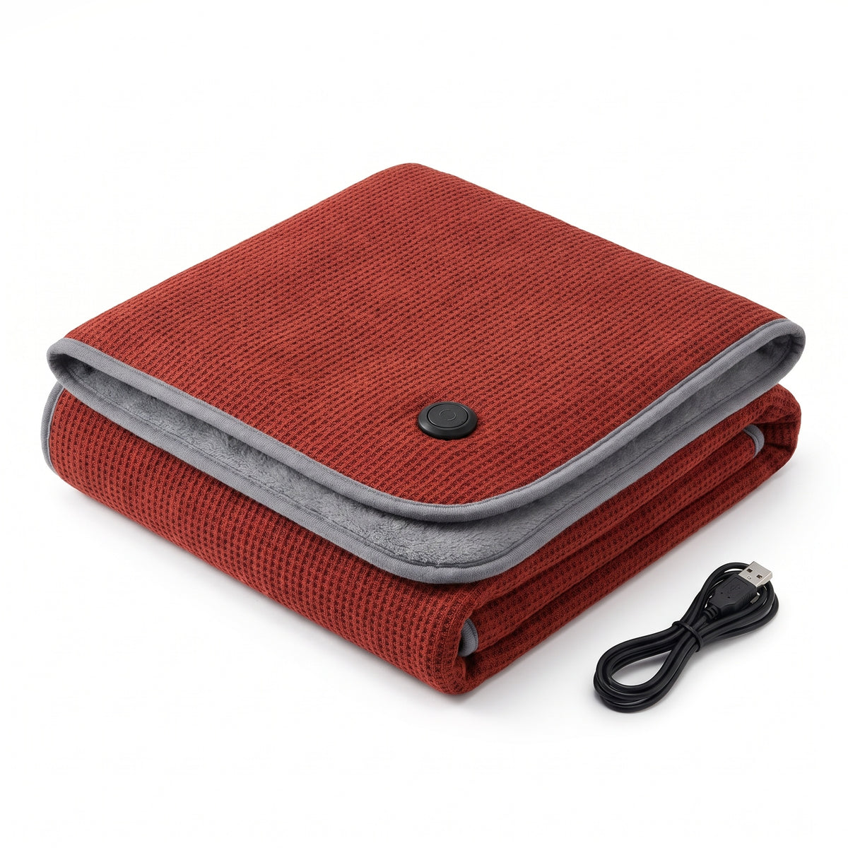 Folded brick red waffle knit USB heated blanket with grey trim