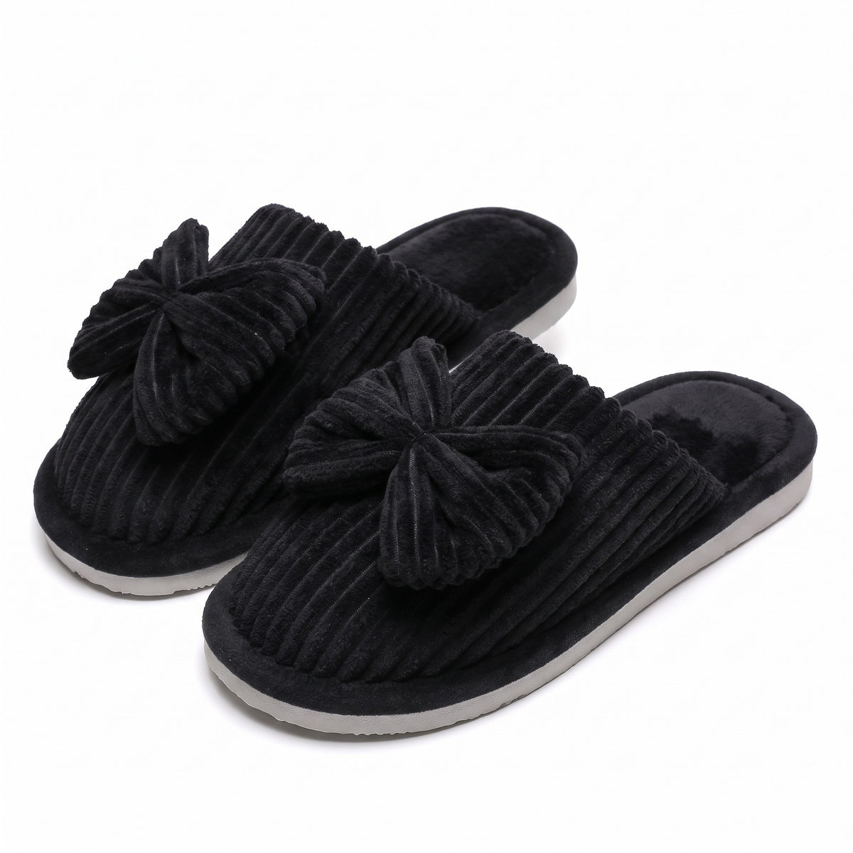 Black corduroy mule slippers with oversized bow