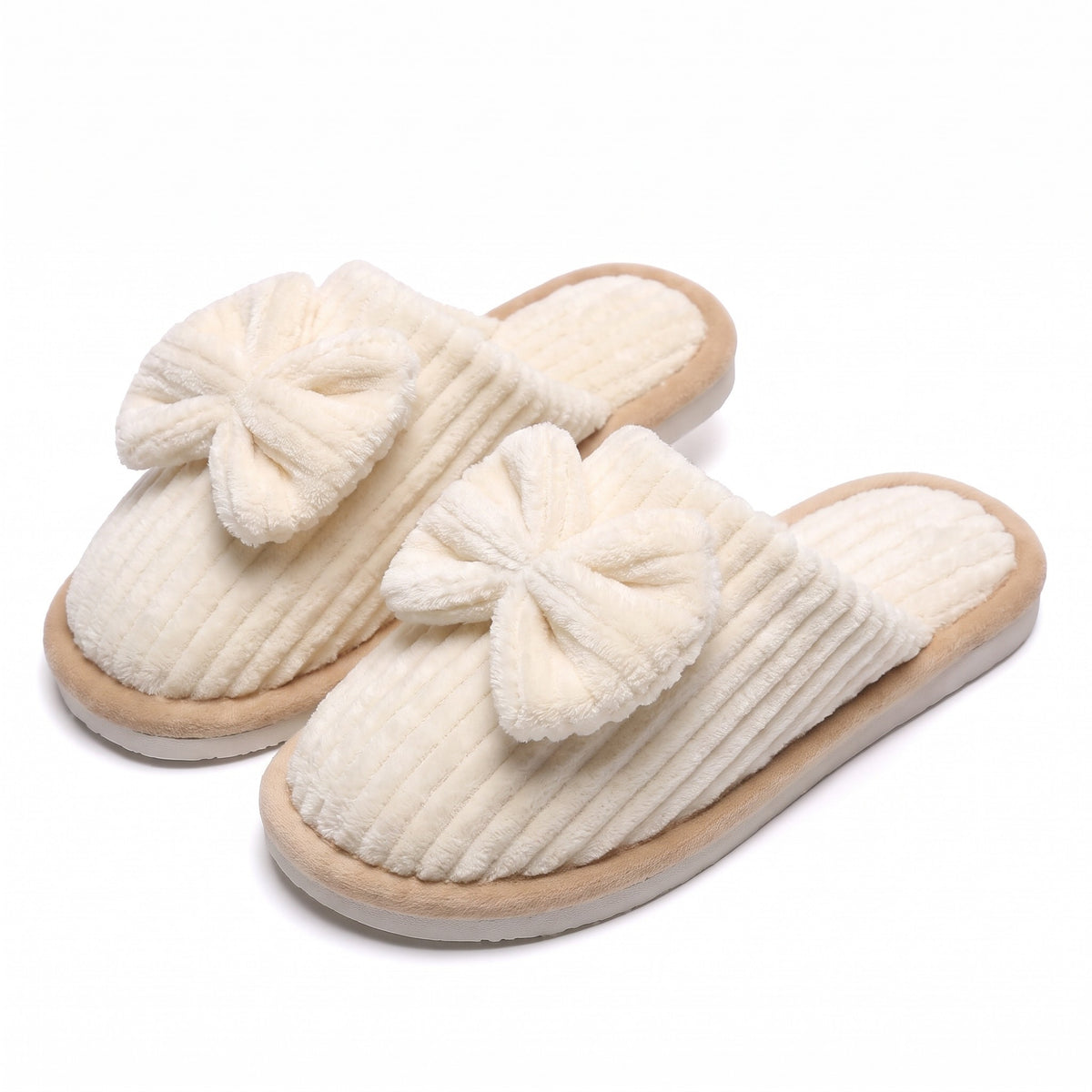 Cream corduroy mule slippers with oversized bow