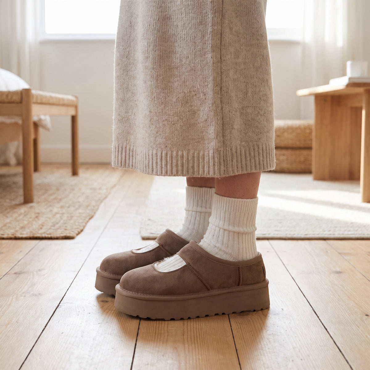 Woman in white socks wearing taupe Mary Jane slippers